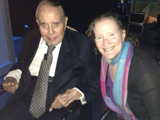 Senator Bob Dole with Rhonda at event in his honor. Both using wheelchairs smiling at camera.