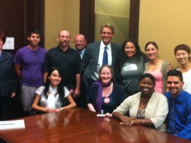 11 students with disabilties and advocates meeting with Senator Flake.