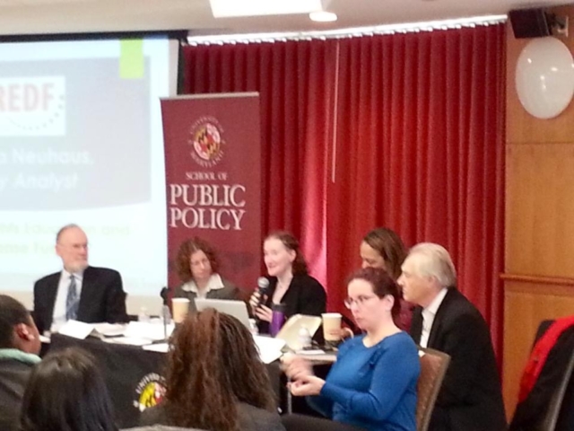 Panel of speakers with Rhonda speaking at the University of Maryland School of Public Policy.