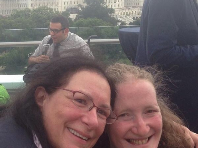 Rhonda and Tari Susan Hartman at event with view of the Capitol.