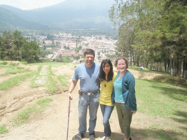 Stopping with colleagues at a viewpoint with mountains in distance.
