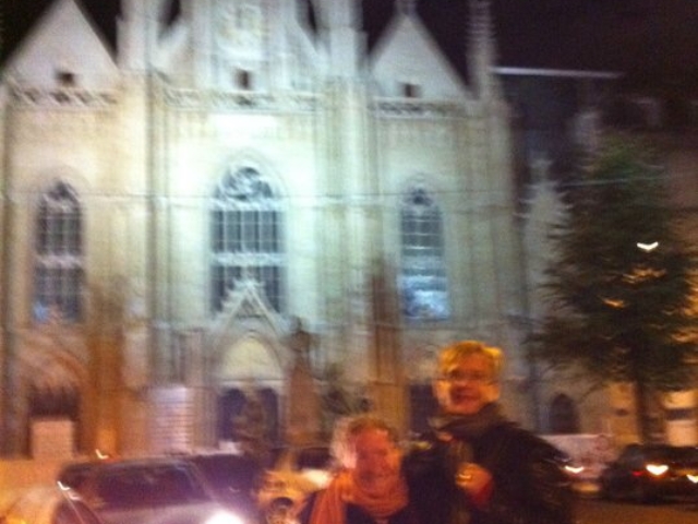 Rhonda with colleague in front of a French cathedral