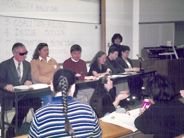 Rhonda presenting on a panel with other professionals with disabiltiies. Tokyo, Japan, 1998
