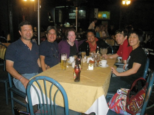 Six Guatemalan disability advocates with Rhonda enjoying a local meal.
