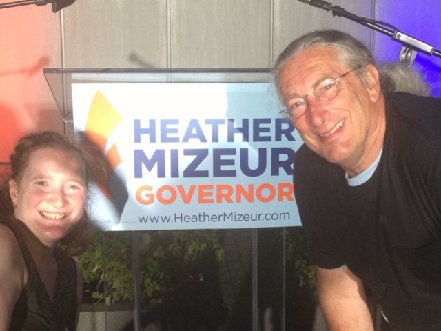 Rhonda with colleague before a sign that says "Heather Mizeur, Governor, www.heathermizeur.com"