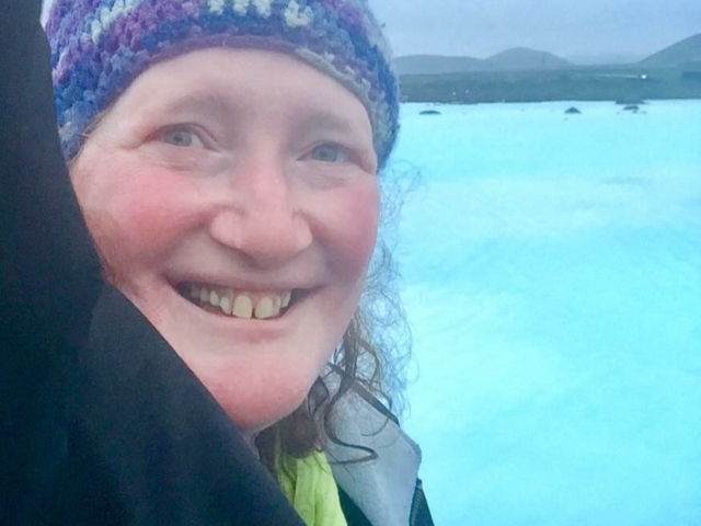 Rhonda smiling in front of the blue lagoon, Iceland.