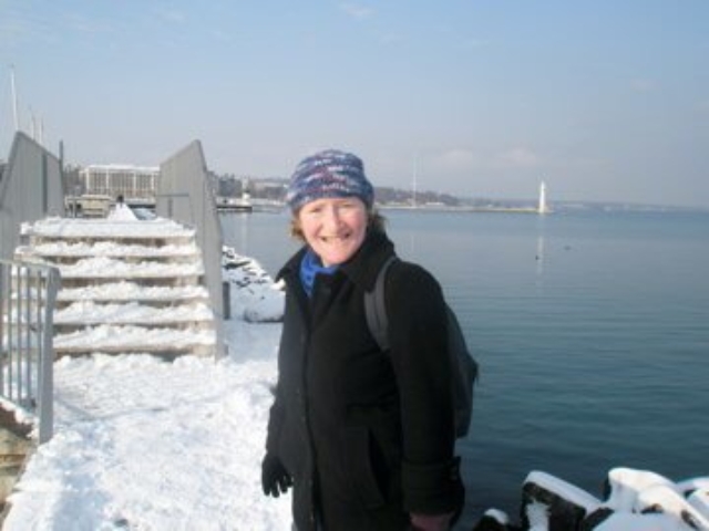 Rhonda wearing a winter hat in front of Lake Geneva