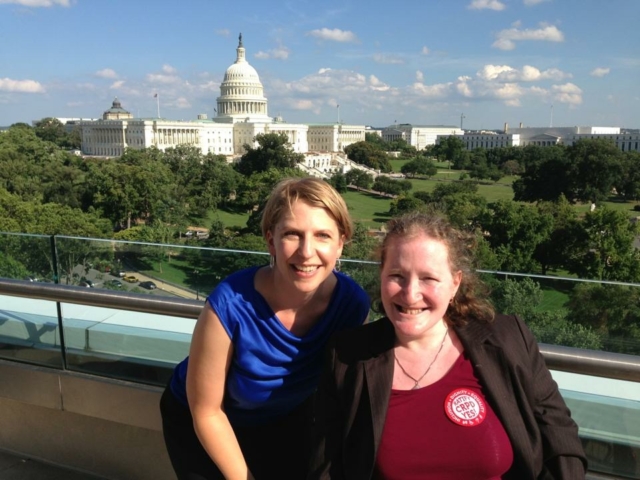 Rhonda with colleague in front of a great view of the D.C. Capitol and mall.
