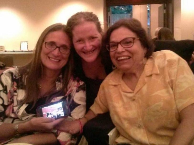 Judy Heumann, Marca Bristo and Rhonda, smiling.