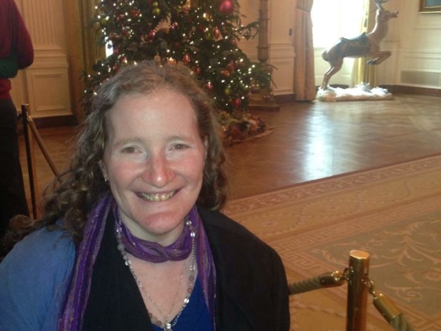 Rhonda in White House before roped off area with Christmas tree