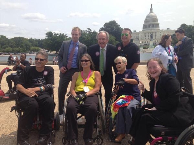 Senator Harkin with CRPD advocates at rally by US Capitol.