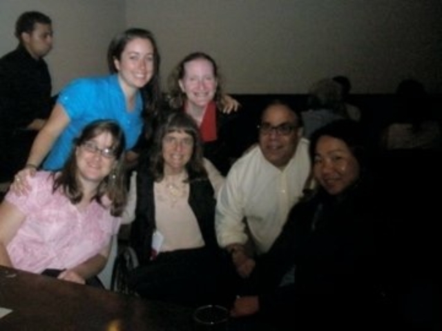 Rhonda with 5 other colleagues, some using wheelchairs.