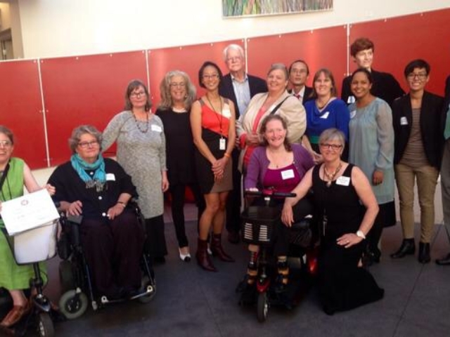 14 DREDF staff with Senator Harkin and Congressman Miller at the Ed Roberts Campus for event.