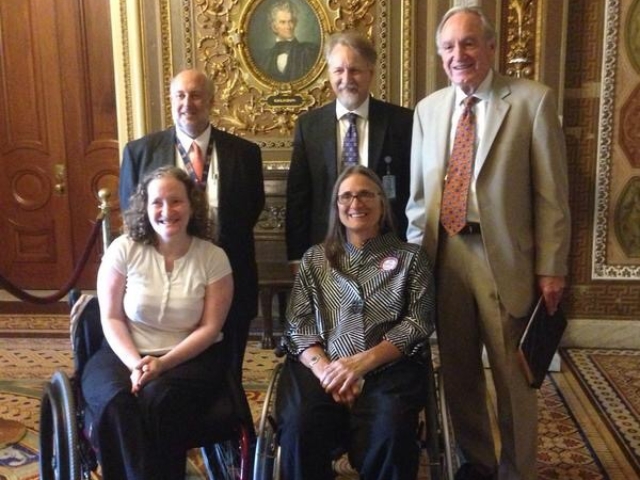 Senator Harkin with his staff and Marca Bristo with Rhonda in the Senate for motions on the CRPD.