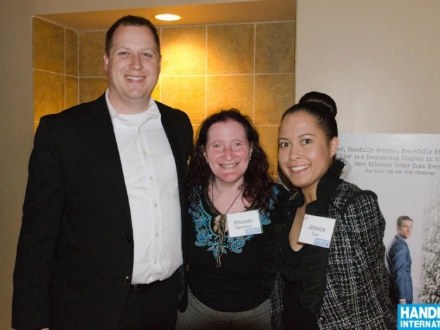3 people smiling at the camera at an HI event: Jessica Cox, Patrick Chamberlain and Rhonda