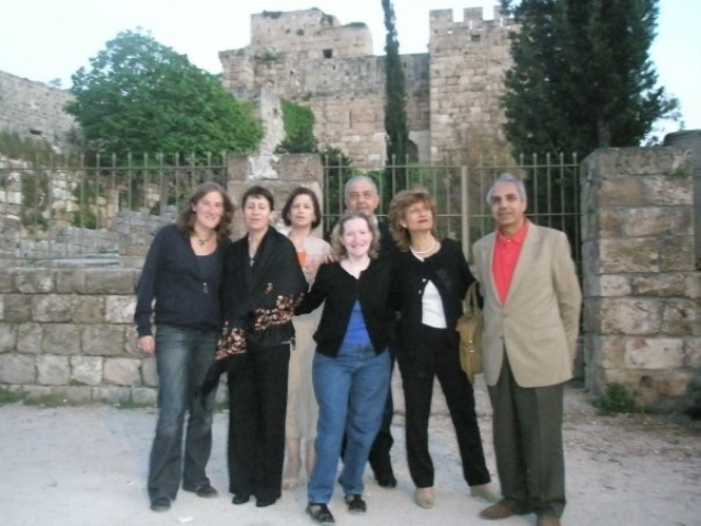 Rhonda and 6 Lebanese and Palestinian colleagues in front of an old ruin after a meeting