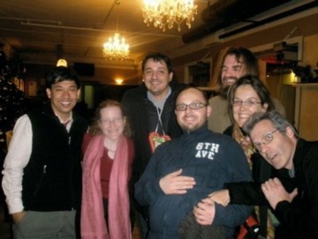 Seven HI colleagues gathered smiling in Germany.