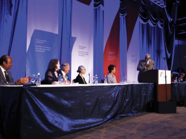 On the podium of the Leadership Conference of Civil and Human Rights Gala, 2014. Listening to Wade Henderson.