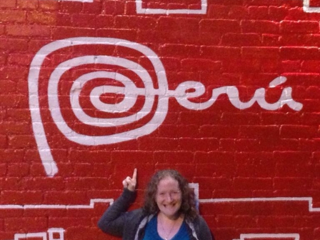 Rhonda with a big sign above her saying Peru