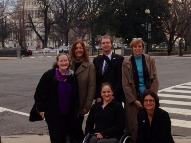 Rhonda with national disability rights colleagues on the streets of DC near and with a view of the Capitol)