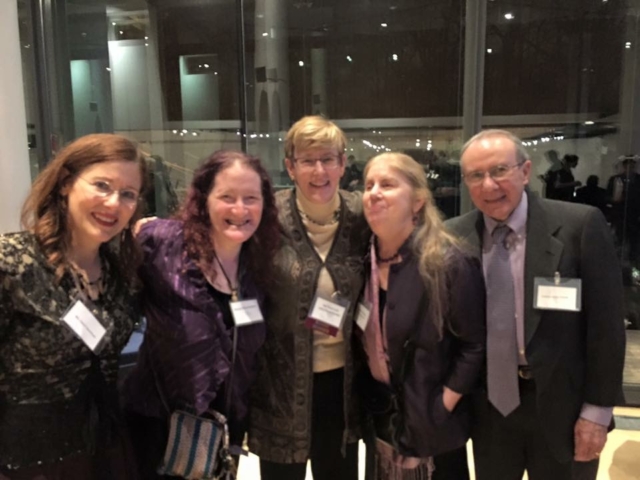 Rhonda with 4 colleagues before big windows at the USICD gala