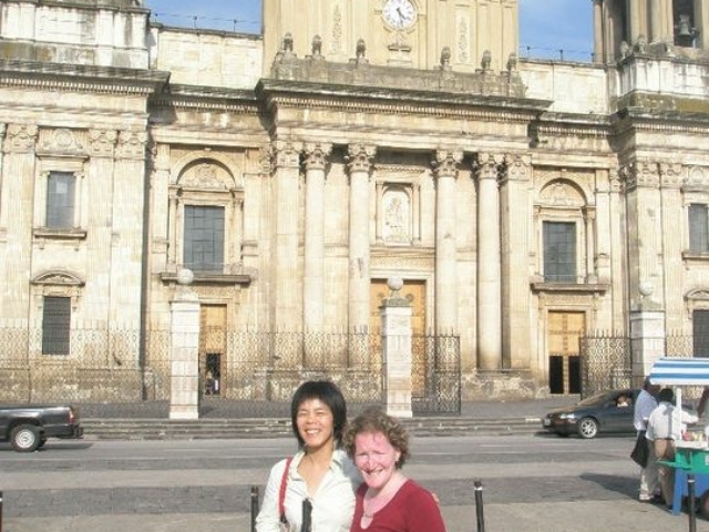 Rhonda with colleague Silvia Quan in front of a cathedral in Guatemala City.