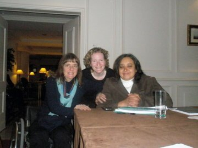 Rhonda with 2 colleagues at the GPDD board meeing table