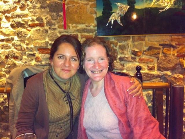 Rhonda with colleague in front a a brick wall France, 2010.