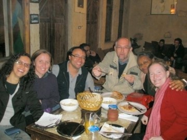 Rhonda at a meal with 5 HI colleagues in Jordan.