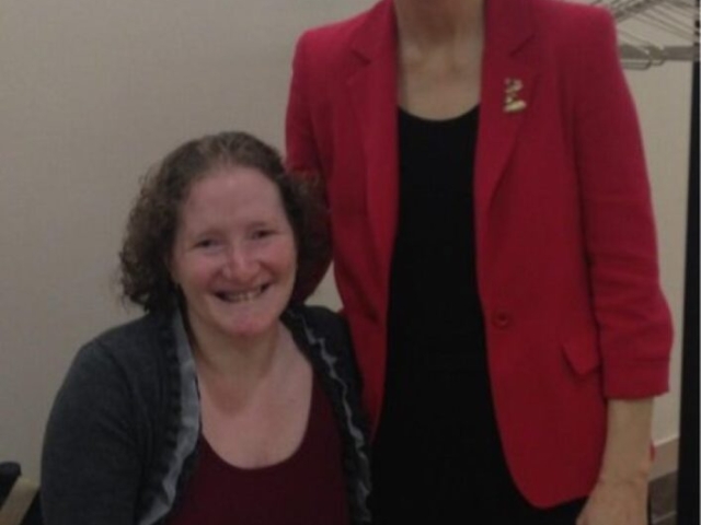 Senator Warren and Rhonda meet in the Senate halls.