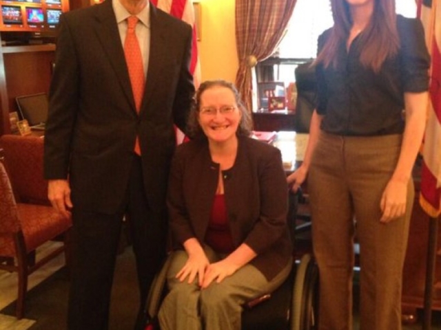 Rhonda and colleague with Senator Portman on CRPD.
