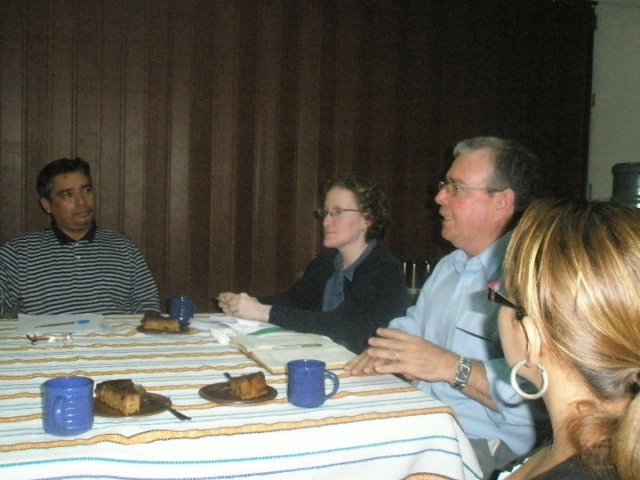 Individuals with disabilities around a table in discussion, El Salvador 2010.